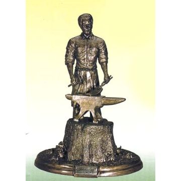 JD - Misc - Figurine of Mr. John Deere standing at anvil -