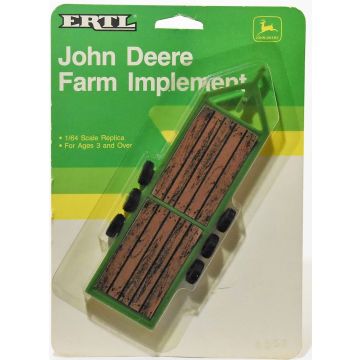 JD -  - Trailer Machinery triple axle has sticker on deck - 1/64